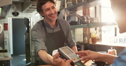 Customer paying for their order at a restaurant.