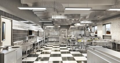 Modern industrial kitchen with silver equipment.